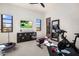 Home gym with Peloton bike and weight bench at 26872 N 102Nd St, Scottsdale, AZ 85262