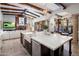 Open kitchen with expansive island, farm sink and breakfast bar at 26872 N 102Nd St, Scottsdale, AZ 85262