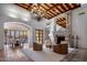 Spacious living room with ornate fireplace and high ceilings at 26872 N 102Nd St, Scottsdale, AZ 85262