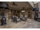 Covered patio with seating area and outdoor TV at 26872 N 102Nd St, Scottsdale, AZ 85262