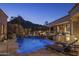 Inviting pool at night with mountain views at 26872 N 102Nd St, Scottsdale, AZ 85262