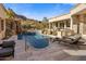 Luxury pool with waterfall feature and expansive patio at 26872 N 102Nd St, Scottsdale, AZ 85262