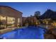 Luminous pool at night with view into main bedroom at 26872 N 102Nd St, Scottsdale, AZ 85262