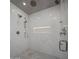 Spa-like shower with herringbone tile and rainfall shower head at 26872 N 102Nd St, Scottsdale, AZ 85262