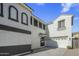 Two-story home with white stucco and garage at 4132 E Santa Fe Ln, Gilbert, AZ 85297