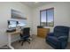 Home office with a large desk, comfortable chair, and dual monitors at 4132 E Santa Fe Ln, Gilbert, AZ 85297