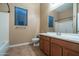 Clean bathroom with a shower/tub combo, toilet and wood vanity at 4742 S Primrose Dr, Gold Canyon, AZ 85118