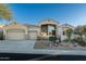 Beautiful stucco home with 3-car garage, mature landscaping, and desert landscaping at 4742 S Primrose Dr, Gold Canyon, AZ 85118