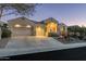 Stunning curb appeal with a two-car garage and mature desert landscaping at 4742 S Primrose Dr, Gold Canyon, AZ 85118