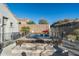 Relax in this private hot tub, featuring stone accents and a surrounding fence at 4742 S Primrose Dr, Gold Canyon, AZ 85118