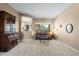 Cozy living room with large window, sofa, and views of the backyard at 4742 S Primrose Dr, Gold Canyon, AZ 85118