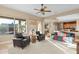 Spacious living room with leather armchairs and large windows at 4742 S Primrose Dr, Gold Canyon, AZ 85118