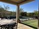 Relaxing patio area with seating and a view of the pool and putting green at 4742 S Primrose Dr, Gold Canyon, AZ 85118