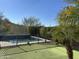 Private backyard with a sparkling pool and a putting green at 4742 S Primrose Dr, Gold Canyon, AZ 85118