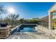 Enjoy this refreshing pool with a waterfall feature and a spacious deck at 4742 S Primrose Dr, Gold Canyon, AZ 85118