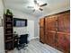 Bright bedroom with built-in murphy bed, desk, and ample storage at 4913 W Pedro Ln, Laveen, AZ 85339