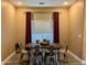 Bright dining room with a farmhouse table and seating for six at 4913 W Pedro Ln, Laveen, AZ 85339