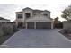 Two-story house with a three-car garage and landscaped front yard at 4913 W Pedro Ln, Laveen, AZ 85339