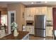 Kitchen with stainless steel appliances and custom cabinetry at 4913 W Pedro Ln, Laveen, AZ 85339