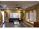 Bright living room with bay window, hardwood floors, and ceiling fan at 4913 W Pedro Ln, Laveen, AZ 85339