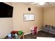 Playroom with a whiteboard, ' furniture, and ample space at 4913 W Pedro Ln, Laveen, AZ 85339