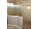 Large walk-in shower with tiled walls and glass enclosure at 4913 W Pedro Ln, Laveen, AZ 85339