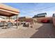 Desert landscaping with patio furniture and built-in BBQ at 6131 S Eagle Pass Rd, Gold Canyon, AZ 85118