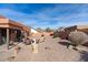 Relaxing backyard patio with fire pit and seating area at 6131 S Eagle Pass Rd, Gold Canyon, AZ 85118