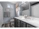 Double vanity bathroom with a modern look and marble countertops at 6131 S Eagle Pass Rd, Gold Canyon, AZ 85118