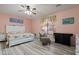 Spacious bedroom with a ceiling fan and floral bedding at 6131 S Eagle Pass Rd, Gold Canyon, AZ 85118