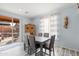 Bright dining room features a table with six chairs and sliding glass doors leading to a patio at 6131 S Eagle Pass Rd, Gold Canyon, AZ 85118