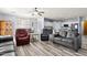 Bright living room with gray sofas and wood-look floors at 6131 S Eagle Pass Rd, Gold Canyon, AZ 85118