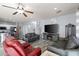 Spacious living room with gray sofas, fireplace, and wood-look floors at 6131 S Eagle Pass Rd, Gold Canyon, AZ 85118