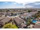 Aerial view of a residential area, highlighting a house with a pool at 702 E Nancy Ave, San Tan Valley, AZ 85140