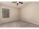 Bright bedroom with carpeted floor and ceiling fan at 702 E Nancy Ave, San Tan Valley, AZ 85140