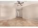 Spacious bedroom with tile floors and ceiling fan at 702 E Nancy Ave, San Tan Valley, AZ 85140