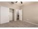 Bedroom with carpet, ceiling fan, and sliding door closet at 702 E Nancy Ave, San Tan Valley, AZ 85140