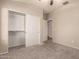 Bedroom with sliding door closet and carpet flooring at 702 E Nancy Ave, San Tan Valley, AZ 85140