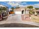 Single-story home with a two-car garage and landscaped front yard at 702 E Nancy Ave, San Tan Valley, AZ 85140