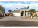 One-story house with a two-car garage, and desert landscaping at 702 E Nancy Ave, San Tan Valley, AZ 85140