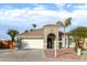 One-story house with a two-car garage, and desert landscaping at 702 E Nancy Ave, San Tan Valley, AZ 85140