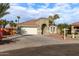 One-story house with a two-car garage, and desert landscaping at 702 E Nancy Ave, San Tan Valley, AZ 85140