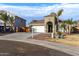 One-story house with a two-car garage, and desert landscaping at 702 E Nancy Ave, San Tan Valley, AZ 85140