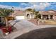 Single-story house with attached garage and landscaping at 702 E Nancy Ave, San Tan Valley, AZ 85140