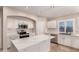 Modern kitchen with white cabinets and quartz counters at 702 E Nancy Ave, San Tan Valley, AZ 85140