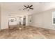 Bright living room with tile floors and kitchen view at 702 E Nancy Ave, San Tan Valley, AZ 85140