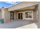 Covered patio with sliding glass doors and exterior access at 702 E Nancy Ave, San Tan Valley, AZ 85140