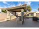 Covered patio with built-in bar and shade structure at 702 E Nancy Ave, San Tan Valley, AZ 85140