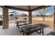 Park picnic area with tables under a covered pavilion at 702 E Nancy Ave, San Tan Valley, AZ 85140