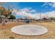 Circular playground with a slide and play equipment at 702 E Nancy Ave, San Tan Valley, AZ 85140